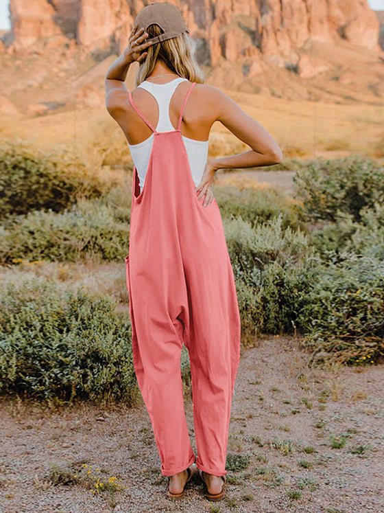  Back view of the Double Take Jumpsuit emphasizing the relaxed fit and pocket detail.