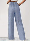 Back view of Drawstring Striped Elastic Waist Pants, featuring vertical stripes and a relaxed wide-leg design.