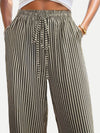 Front view of Drawstring Striped Elastic Waist Pants, featuring vertical stripes and a relaxed wide-leg design.