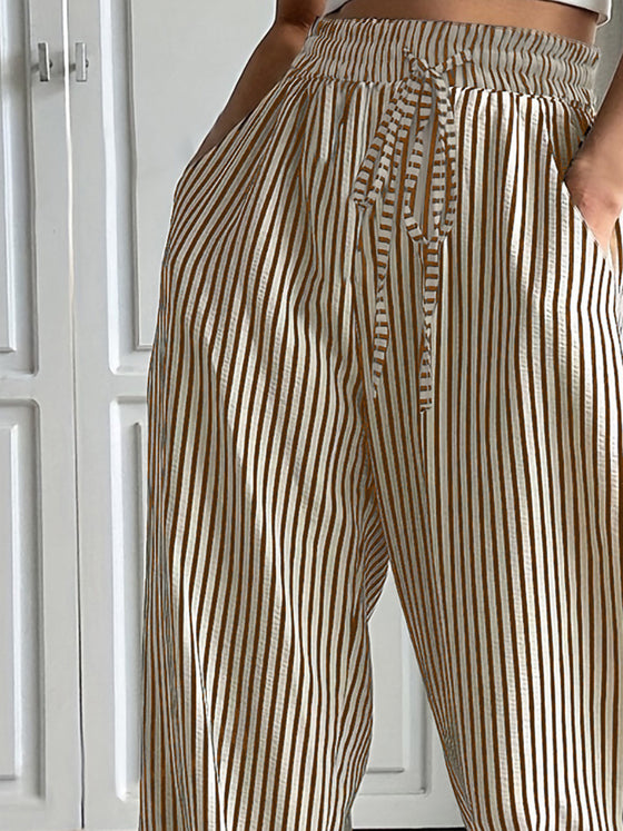 Side view of Drawstring Striped Pants showing the elastic waistband and functional side pockets.