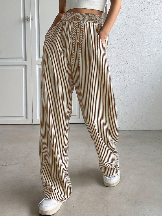 Side view of Drawstring Striped Pants showing the elastic waistband and functional side pockets.