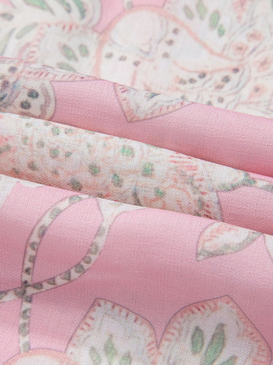  Fabric texture close-up revealing the lightweight, breathable material of the pink floral puff sleeve blouse.