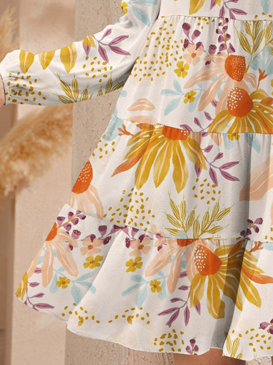 Close-up of the floral print on the FAM-FAM Mini Dress, showcasing its vibrant colors and intricate details.