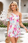 Front view of Floral Asymmetrical Neck Tie Waist Romper with one-shoulder neckline and belted waist.