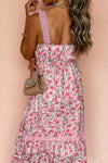  Back closeup view of the pink floral square neck dress, showing soft floral fabric and stitch detailing for an elegant and refined finish.