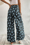 Back view of the Floral Pocket Culottes, showing the flowy wide-leg silhouette and floral pattern.