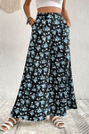 Woman wearing floral pocket culottes with a wide-leg fit and side pockets, ideal for casual outings and vacations.