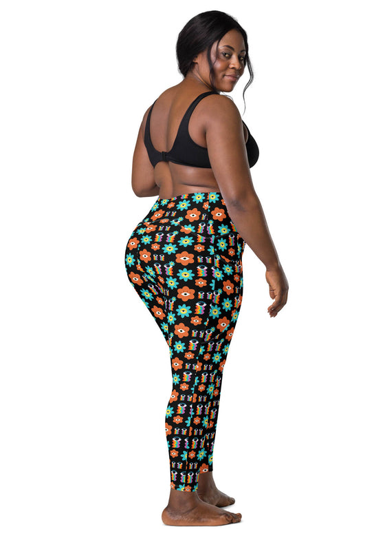 Back view of plus-size woman in Floral Print Black Yoga Leggings with Pockets. High-waisted fit with floral print, offering comfort and style for yoga or casual wear.
