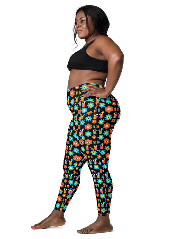 Side view of plus-size woman wearing Floral Print Black Yoga Leggings with Pockets. Comfortable high-rise leggings with a stylish floral pattern and convenient pockets.