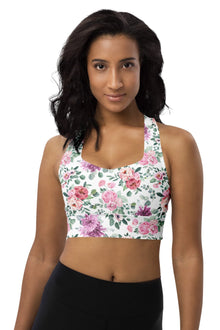  Woman wearing Floral Print White High Impact Sports Bra with vibrant floral design. Provides high support and comfort for intense workouts, featuring moisture-wicking fabric and a breathable sports mesh lining for a cool, dry fit.