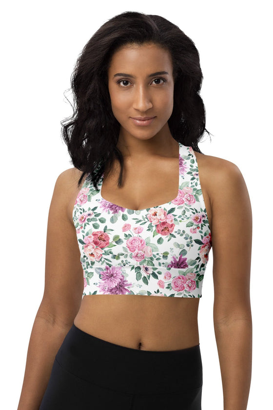 Woman wearing Floral Print White High Impact Sports Bra with vibrant floral design. Provides high support and comfort for intense workouts, featuring moisture-wicking fabric and a breathable sports mesh lining for a cool, dry fit.