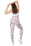 Back view of woman in Floral Print White high-waisted leggings with side pockets. Stylish floral print and supportive design, perfect for any workout or casual activity.