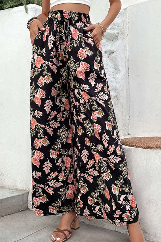 Front view of Floral Pull-On Wide Leg Pants with a floral pattern and elastic waistband, styled with a casual top.