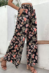 Side view of Floral Pull-On Wide Leg Pants, showcasing the flowy wide-leg design and floral pattern.