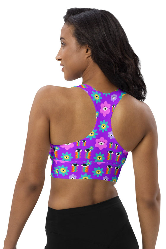 Back view of the Floral Rainbow Print Pink Racerback Longline Sports Bra. Racerback design for full range of motion, ensuring comfort and support during high-impact activities or all-day wear.