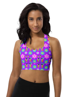  Racerback YogWoman wearing the Floral Rainbow Print Pink Racerback Longline Sports Bra. Featuring a vibrant rainbow effect with purple, pink, and blue hues, offering high support and a comfortable fit for workouts and casual wear.a Sports Bra For Women