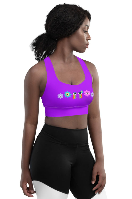 Side view of the Floral Rainbow Print Purple Racerback Longline Sports Bra. The groovy rainbow-inspired design provides excellent support and a flattering longline cut for added coverage during workouts.
