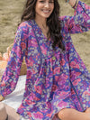 Close view of the Floral Ruched V-Neck Long Sleeve Dress, highlighting the ruched detail and long sleeves.