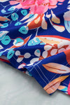 Down close-up of the tie detail on the Floral Tied Mini Skirt, adding a chic touch.