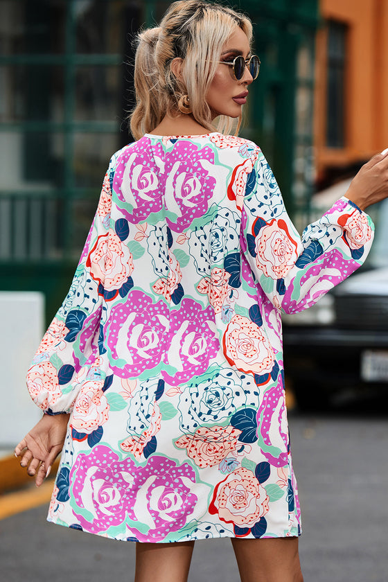 Back view of the Floral V-Neck Long Sleeve Dress, showcasing the bold print and relaxed fit.