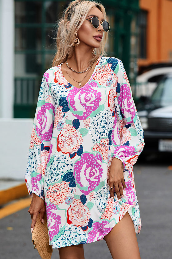 Model wearing the Floral V-Neck Long Sleeve Dress styled with accessories for a chic look.