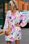 Side view of the Floral V-Neck Long Sleeve Dress, highlighting the floral design and V-neckline.