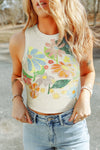 Model wearing the Flower Round Neck Tank featuring a vibrant floral print, round neckline, and soft cotton-blend fabric, styled with denim shorts.

