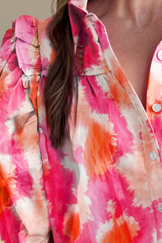 A vibrant frill contrast print collared shirt with half sleeves, styled casually with denim shorts for a chic summer look.