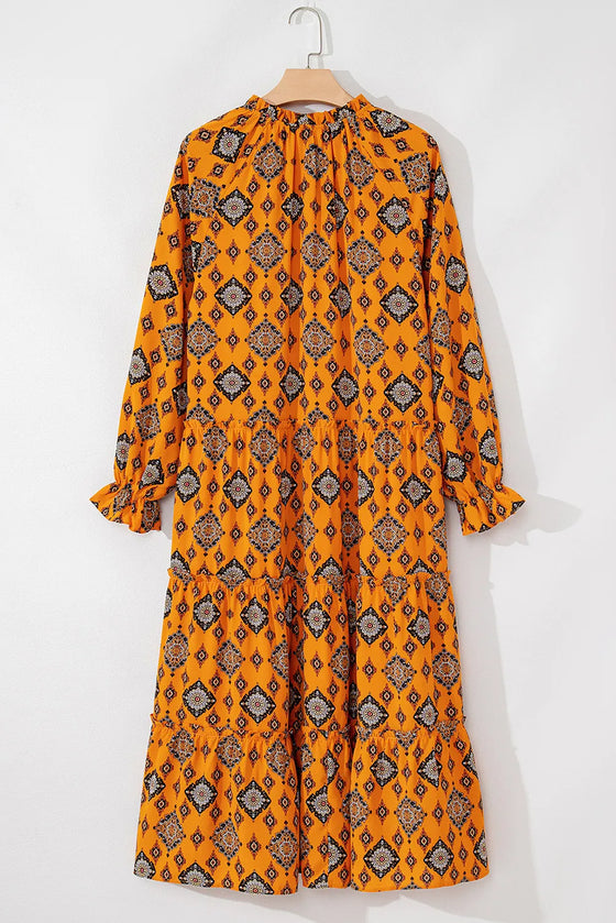 Back view of the Frill Printed Tie Neck Dress with long sleeves and vibrant patterns.