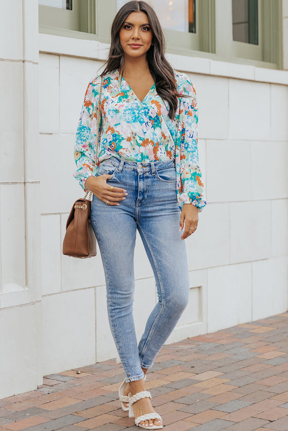 Model shows off the elegant fit of the bodysuit, with exaggerated sleeves adding drama to the otherwise fitted, feminine silhouette.

