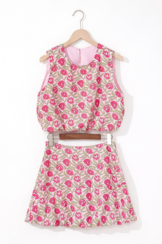 Front view focusing on the bright floral colors of the tank and mini skirt set, featuring a fitted tank top paired with a flowy mini skirt that creates a fun and feminine daytime look.

