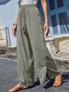 Full Size Tassel Wide Leg Pants with a tasseled tie waist and decorative buttons, designed in a relaxed wide-leg silhouette in green.

