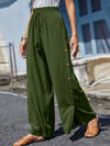 Full Size Tassel Wide Leg Pants with a tasseled tie waist and decorative buttons, designed in a relaxed wide-leg silhouette in green.

