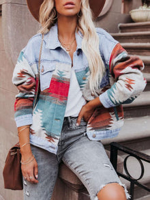  Woman wearing a Geometric Button-Up Long Sleeve Denim Jacket with vibrant prints and denim accents, styled with ripped jeans and a white top for a casual chic look.