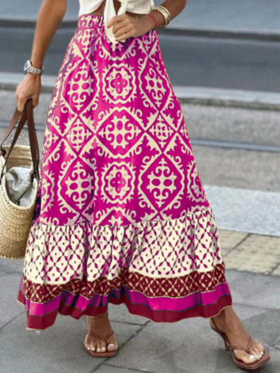 A stylish geometric print elastic waist maxi skirt in earthy tones, paired with a tied white top, ideal for casual and boho-inspired outfits.