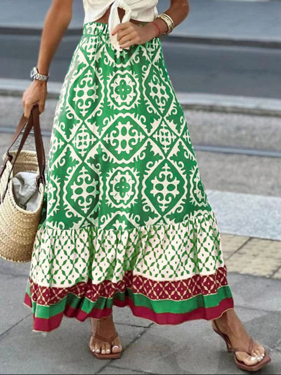 A stylish geometric print elastic waist maxi skirt in earthy tones, paired with a tied white top, ideal for casual and boho-inspired outfits.