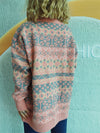 Back view of the Geometric Round Neck Dropped Shoulder Sweater showcasing its cozy design and timeless geometric pattern.