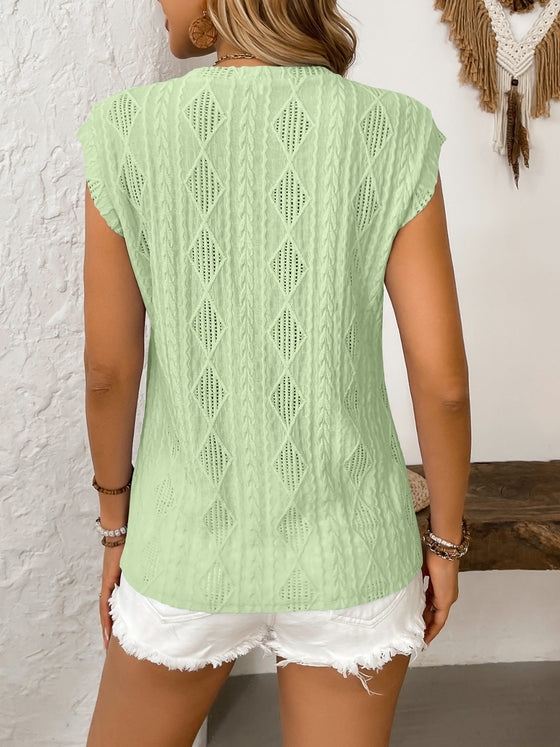 Back view showing the scalloped trim and slightly flared fit, emphasizing breathability and structure from behind.

