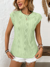 A fresh look at the vibrant green blouse styled with casual bottoms, revealing how the cut flatters the upper body.

