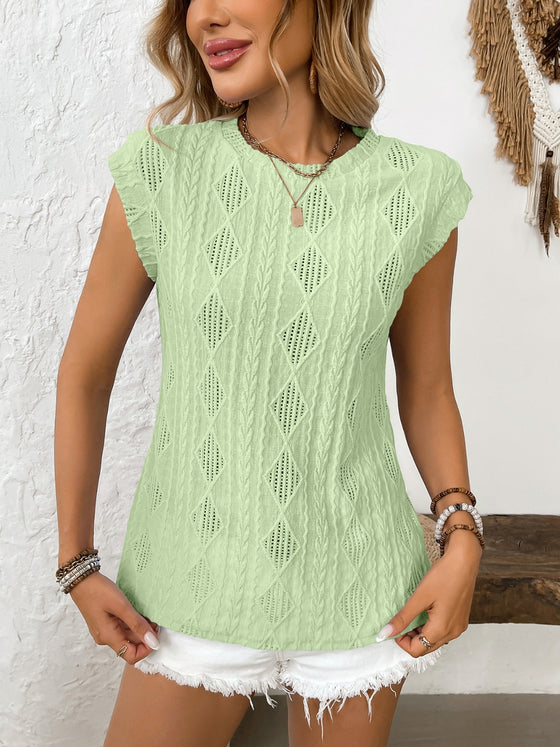 A fresh look at the vibrant green blouse styled with casual bottoms, revealing how the cut flatters the upper body.

