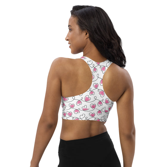 Back view of Infinite Hearts racerback longline sports bra in white. Compression fit with breathable support for high intensity training and movement.