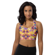  Model wearing Kaleidoscope Fields longline sports bra with high impact support and racerback design. Features vibrant kaleidoscope and blue butterfly print.