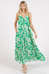 This vibrant kelly green printed v-neck cami maxi dress combines comfort and style with functional pockets, perfect for casual outings.