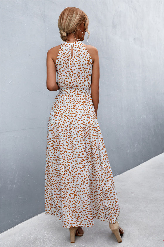Back view of khaki sleeveless printed maxi dress—clean and easy-to-wear silhouette with soft fabric for all-day comfort.