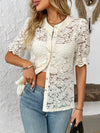Detailed front angle of cream lace half sleeve shirt with subtle floral patterns, styled for modern elegance.