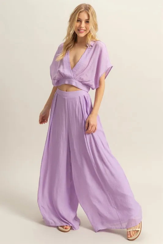 A straight-on image highlighting the relaxed fit of the top and the elegant fall of the wide-leg pants, perfect for casual or elevated wear.

