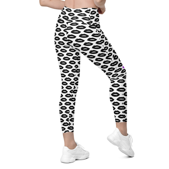 Back view of women’s white leggings with purple and black lips print. High waist gym leggings with pockets for workouts, yoga, or daily fashion.