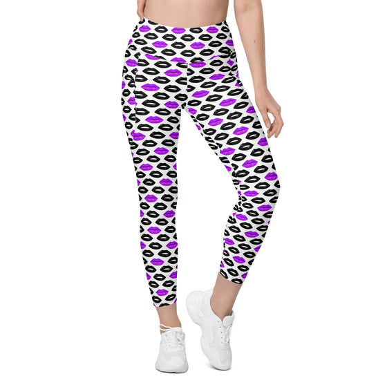 Side angle view of compression leggings in white with black and purple lips print. Women's leggings with pockets, ideal for active or casual wear.