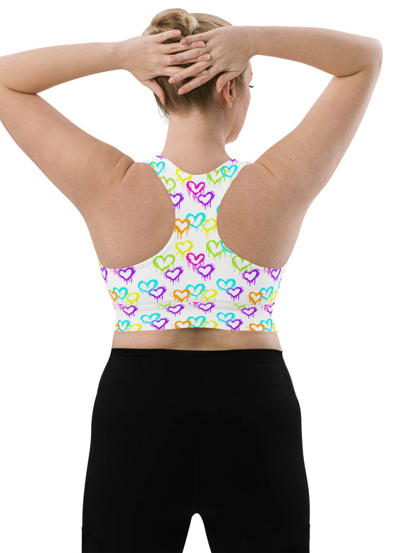 Large-size back view of the Melting Hearts Print White Racerback Sports Bra. Designed with a secure racerback fit, breathable mesh lining, and compression support for high-impact activities.