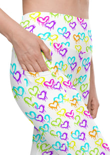  Closeup of Melting Hearts White Compression Leggings showing the pocket design. Stylish high-waisted leggings for women with functional pockets, perfect for workouts or casual wear.